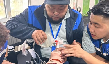 an ambulance driver ventilating a baby model