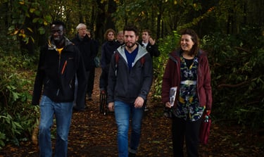 a team walking in the forest with Dorchess from Awe Academy
