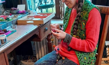 a woman sitting on a chair in a creative room