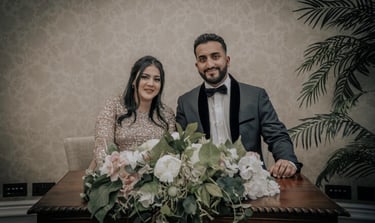 Bride and groom posing for a wedding photograph