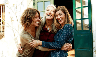 women of menopausal age having a group hug