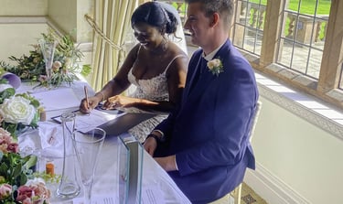 Couple Signing Their Certificate At Their Wedding Ceremony