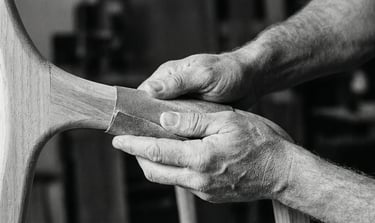 Hands of french craftman sanding an organic piece of wood