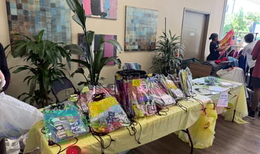 TABLE WITH BOOKBAGS