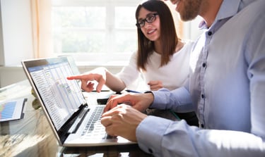 Man and woman discussing data