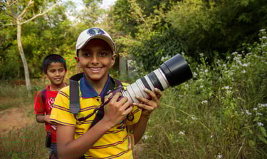two boys with a camera