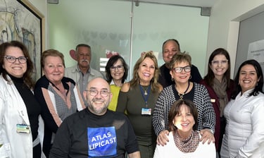a group of people standing around a table