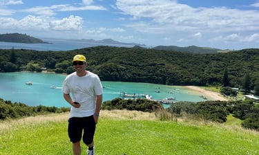 traveller enjoying the scenes over looking bay of islands in northland