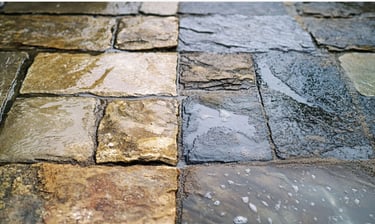 Before and After image of Stone pavers pressure washed and sealed