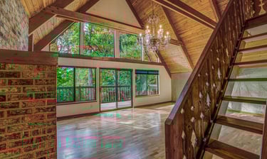 Real estate photo of a living room highlighting interior design details and natural light.