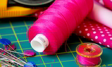 spool of pink thread