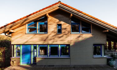 a house with a blue door and harmonic colors
