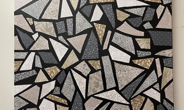 a canvas of a black and white mosaic tile using fabric