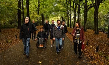 an Awe Academy team walking down a path in a forest