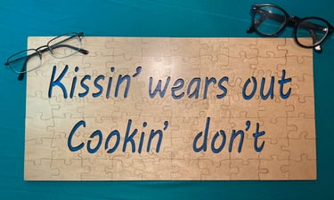 "Kissin' wears out, cookin' don't" jigsaw puzzle
