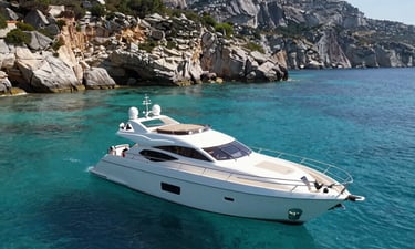 A luxury yacht anchored in a quiet Mediterranean cove, crystal clear turquoise water, rocky cliffs in the background under bright daylight