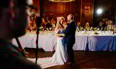 bride and groom having first dance with wedding singer