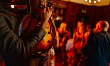 Man playing guitar ar wedding