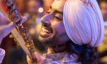 a man in a turban with a sword