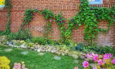Virginia LOVE sign made from flowers and vines at 2123 Rivermont Apartments