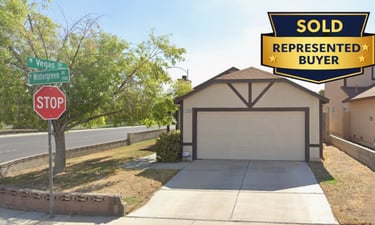 a sold sign for a home in a neighborhood