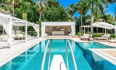 Poolside loungers and shaded pergola at Villa Serenity