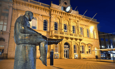 The Sock Man statue, Loughborough Market Place – hosiery heritage memorial