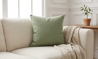 sage green living room color scheme with sage velvet cushion cream sofa and natural linen throw