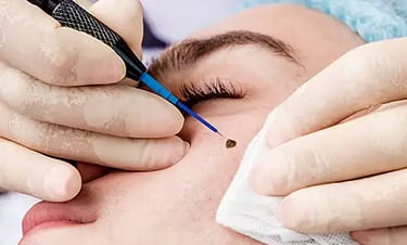 a man getting his eyebrows trimmed up and a woman is getting her eyebrows done