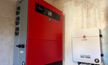 a red and white electric generator unit with a red and black electrical device