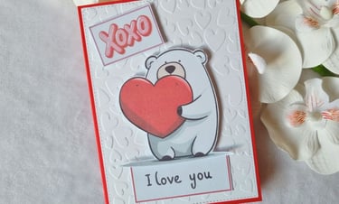 Handmade Valentine's day card with a bear holding a heart