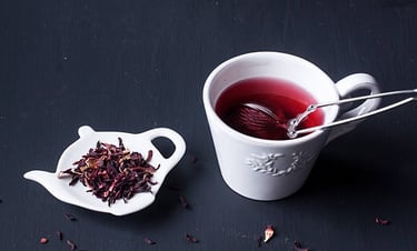a cup of tea with a teapot and a teapot