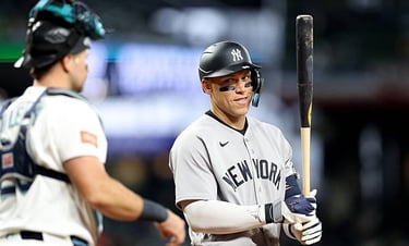 - APRIL 01: Aaron Judge #99 of the New York Yankees looks at Cal Raleigh #29 of the Seattle Mariners in Seattle, Washington