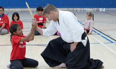 practicing martial arts with weapons in Calgary aikido class