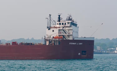 Close-up of the forward pilothouse of huge red freighter Stewart J. Cort.