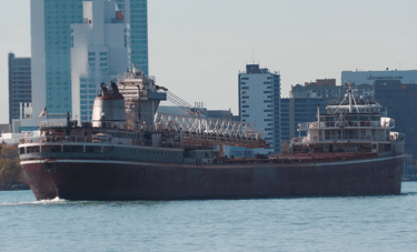 Classic freighter Wilfred Sykes passing the Windsor skyline.