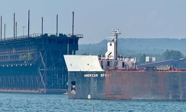 A close-up of the bow of freighter American Spirt in front of the Two Harbors Ore Dock.