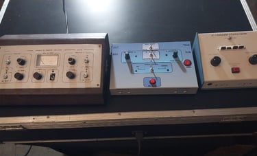 a group of three electronic devices sitting on a table