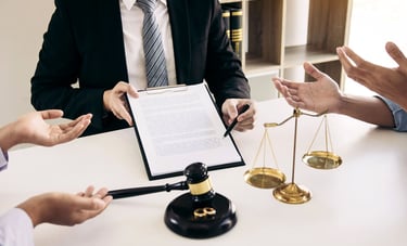 family law court order consultation showing a lawyer with court documents, legal scales, and hands of clients discussing a fa