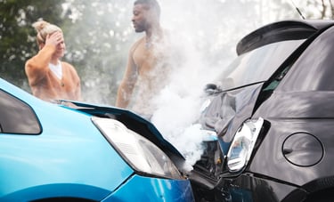 Rideshare Accidents aftermath with two cars involved in a crash, steam rising from the impact, and two concerned passengers s