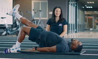 Biokineticist assisting with knee rehabilitation in Randburg