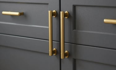 Close-up of elegant charcoal gray custom kitchen cabinets with rich gold handles and soft-close hinges, professional lighting highlighting the texture, North American / US - Los Angeles style.