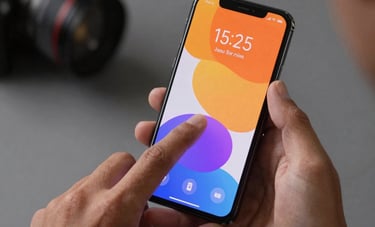 Close-up of a person's hands in a modern North American studio setting, interacting with a high-end Android smartphone. The screen shows a vibrant, user-centric interface with soft shadows and clean typography. The lighting is sophisticated and professional.