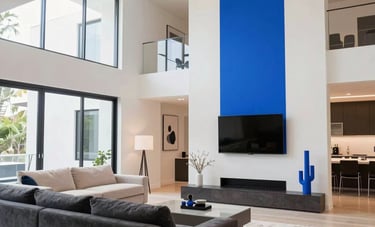 Interior shot of a modern Orlando living space featuring architectural lighting and designer installations. Bright white and electric blue tones create a vibrant energy-flow atmosphere in a contemporary North American home.