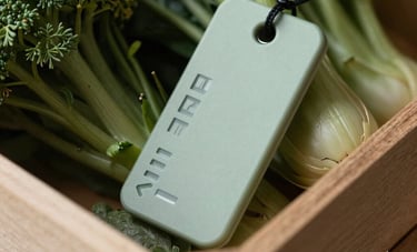 Macro photography of an innovative electronic tracking tag on a wooden crate of fresh produce, professional and authoritative mood, international trade context, palette of Dark Forest and Light Sage.