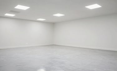 Detailed photography of a newly renovated commercial space in Normandy. The floor is being polished to a high gloss, reflecting the bright white ceiling lights. No debris is visible, conveying a sense of finality and extreme cleanliness.