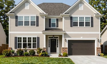 Exterior of a well-maintained, modern suburban house in Maryland, North American / US architecture. Features a tidy lawn and a welcoming front entrance under bright daylight.