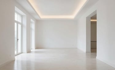 A wide angle shot of a beautifully renovated Southern European living space with high ceilings, crisp white walls, polished floors, and elegant lighting, modern and clean style.