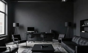 A wide-angle shot of a sophisticated, dark-themed design studio in North America. The space features industrial minimalist architecture and clean black furniture.
