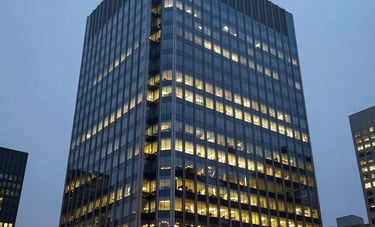 Photography of a high-end corporate building in a North American / US city at dusk, with glowing windows reflecting a misty blue sky, symbolizing global connectivity.